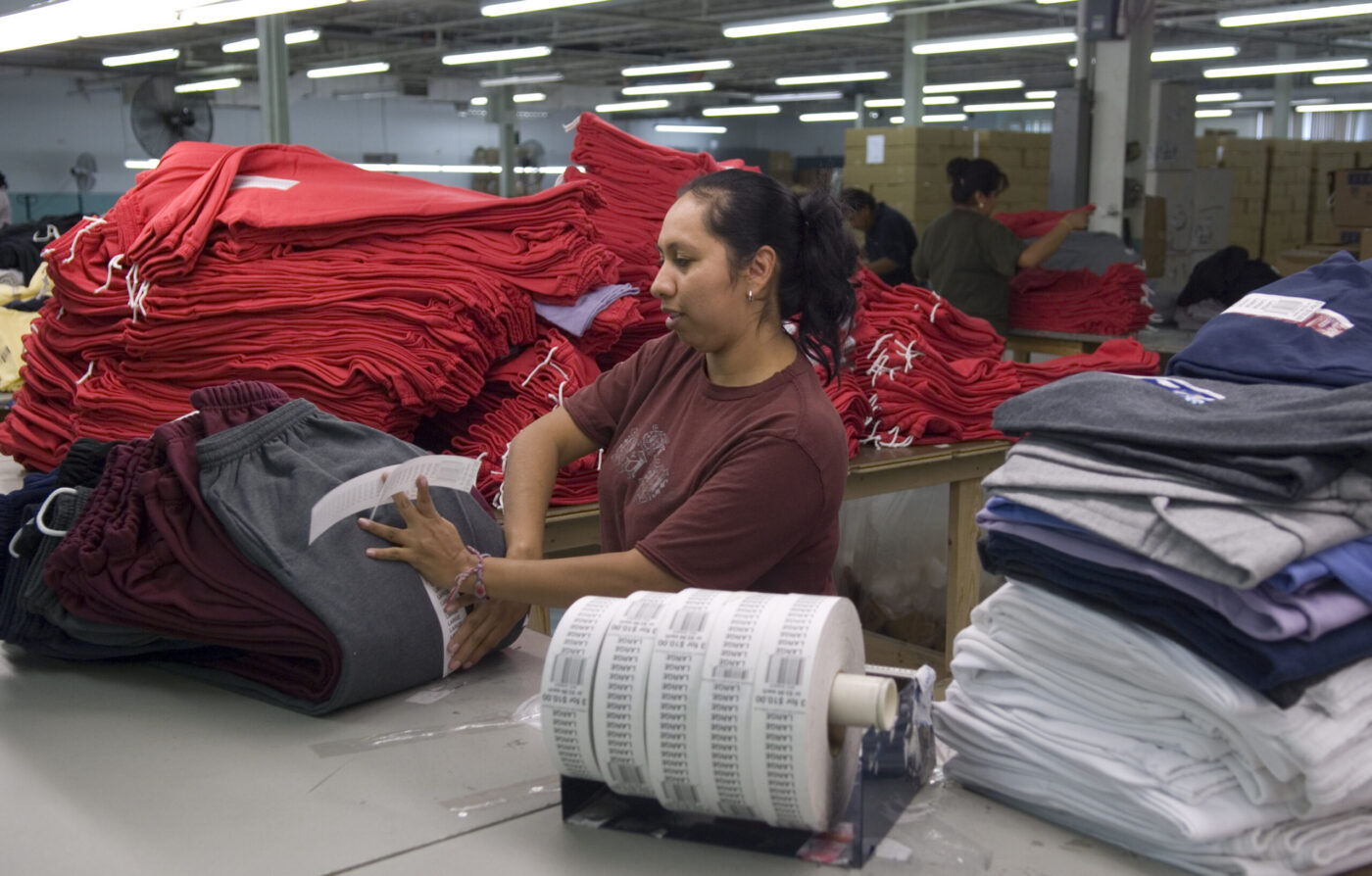 floor-ready services employee providing outsourced re-tagging service